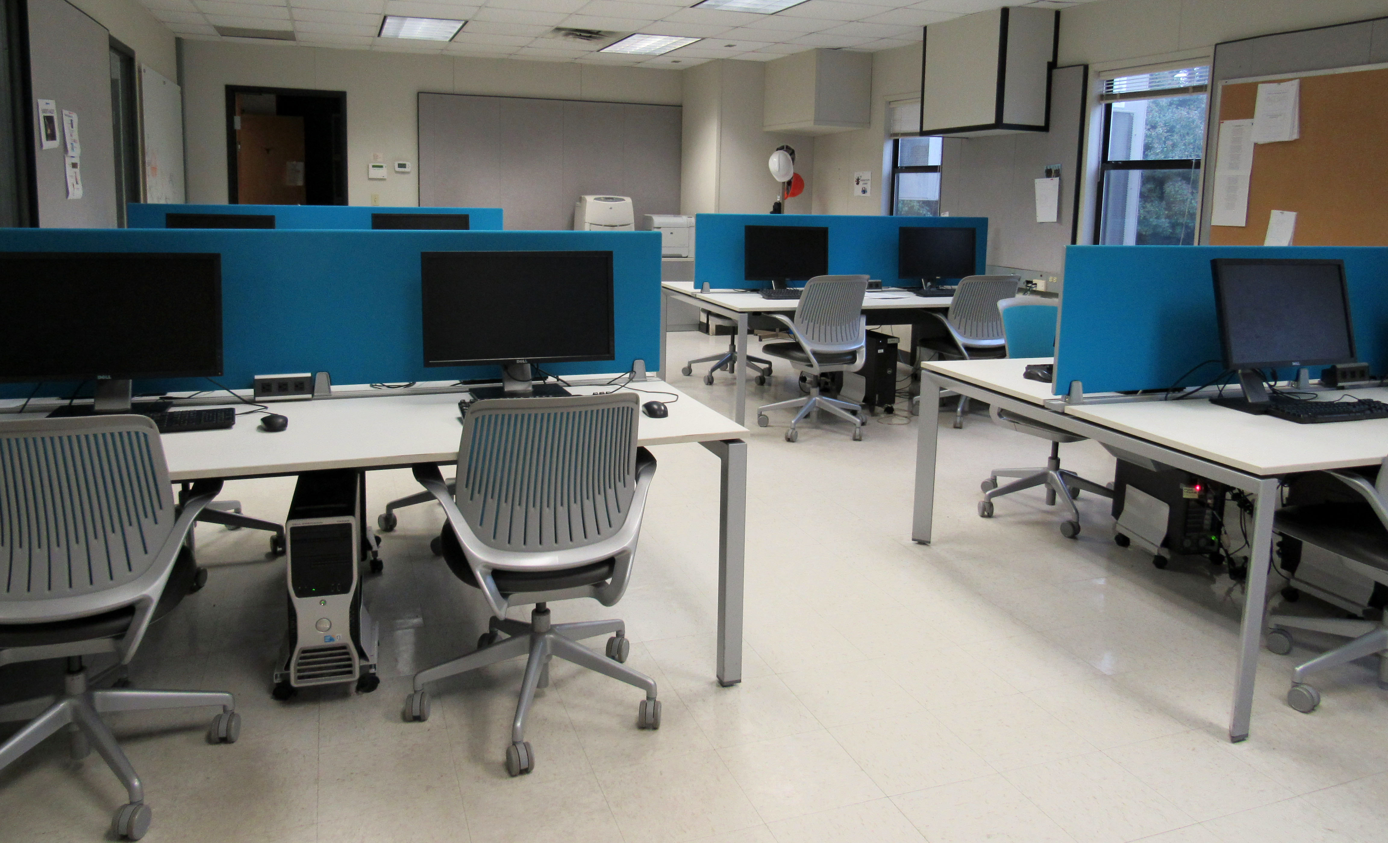 interior of computer lab classroom with chairs and desks