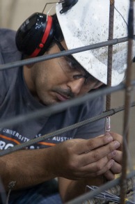 close up of person working, wearing hardhat