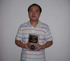 Quan Chen receiving award