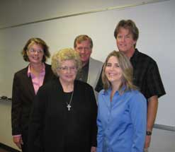 group standing smiling for photo