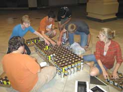 kids building project out of cans