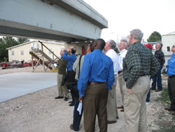 group looking at concrete beam