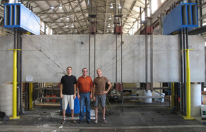 three people standing inside FSEL warehouse